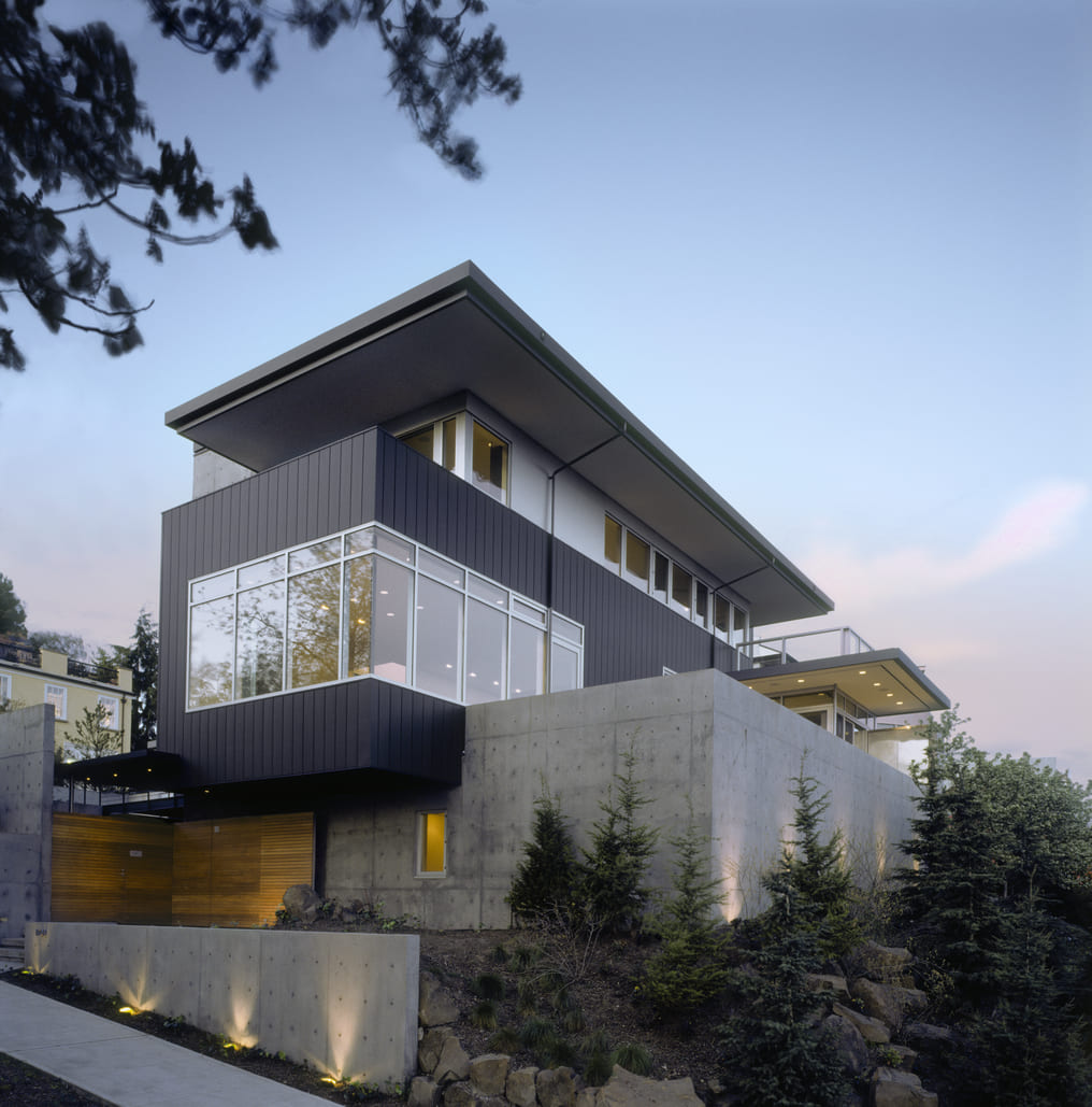 Contemporary Ottawa-area home with cantilevered upper floor and concrete landscape walls